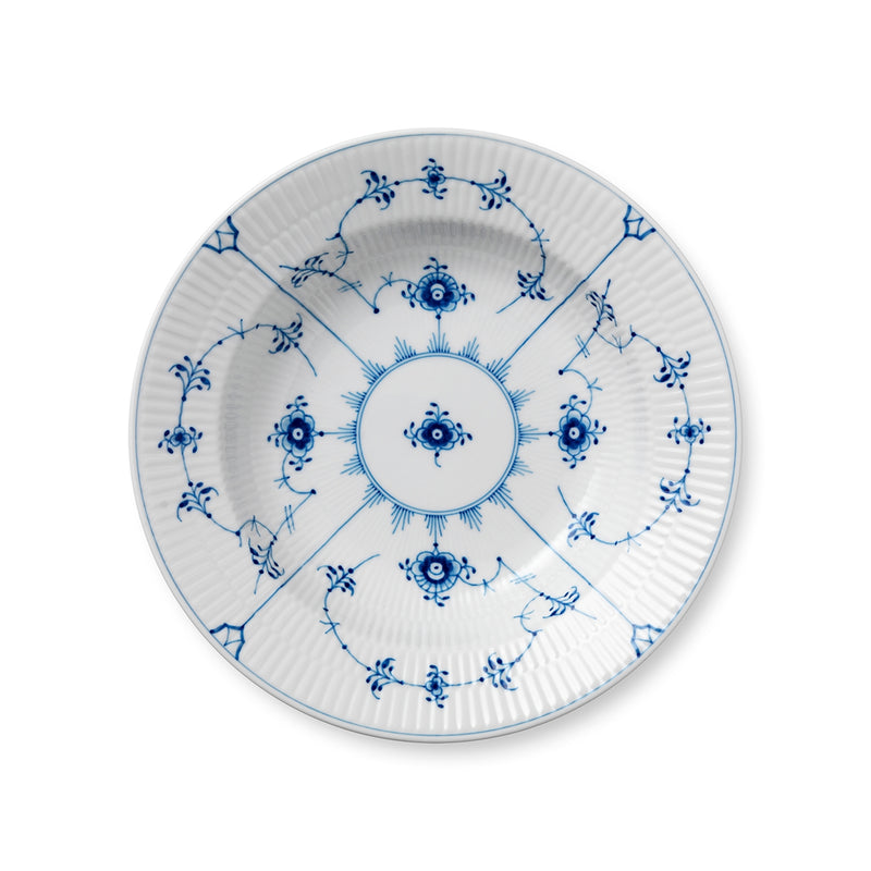 Royal Copenhagen | Blue Fluted Plain Plate Deep, 23cm: A porcelain plate with cobalt-blue floral and scroll pattern, fluted rim, perfect for elegant table settings.