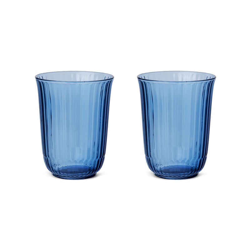 Royal Copenhagen | Waves Highball Glass, Blue, Set of 2 features translucent blue tumblers with flared shape and vertical ribbing, inspired by wave ripples.
