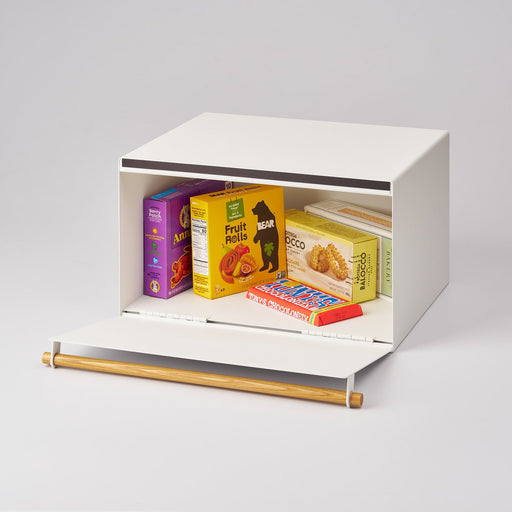 Yamazaki Home Simple Steel Bread Box, White + Wood, open showing assorted snacks, highlighting its storage versatility and seamless design for efficient kitchen organization.