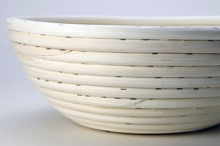 Breadtopia | Round Rattan Bread Proofing Basket and Liner, designed for shaping dough, highlighting quality craftsmanship by the Nguyen family in Vietnam.