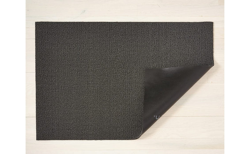Chilewich Solid Shag Mat in Snow, 24 x 72, displayed on a flat surface, showcasing its modern, textured design ideal for indoor and outdoor use.