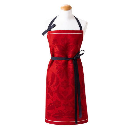 Le Jacquard Francais | PIMENTS APRON featuring red fabric and contrasting black straps, ideal for culinary enthusiasts seeking stylish kitchen wear.