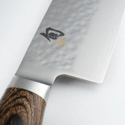 Shun | Premier Chef's Knife, 10 features a hammered tsuchime finish, Damascus pattern, Japanese kanji logo, and a dark wood-composite handle.