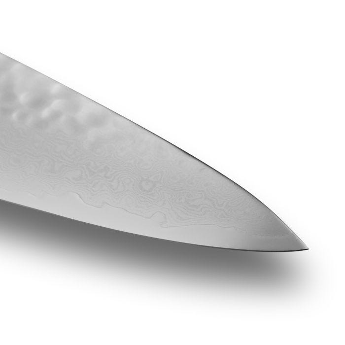 Shun Premier Chef's Knife, 10 blade with tsuchime texture and Damascus pattern, showcasing precision craftsmanship for efficient cutting, ideal for culinary enthusiasts and professionals.