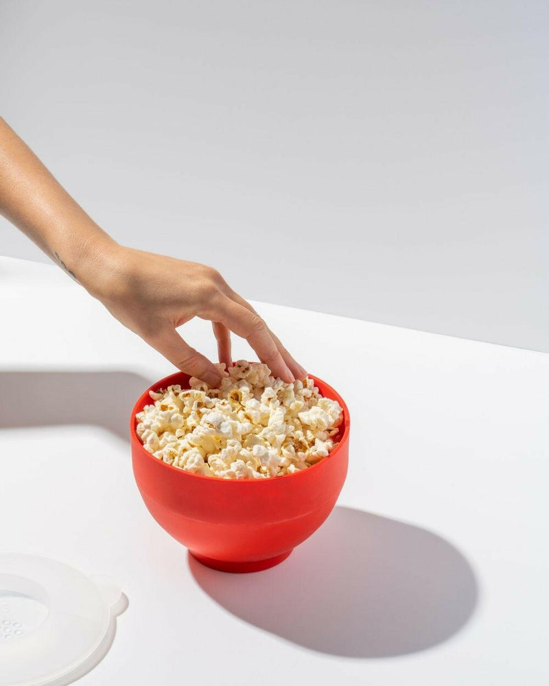 W&P Popcorn Popper Silicone Reusable Maker, Personal Mini Red, shown collapsed and expanded, with a lid doubling as a measuring cup for precise popcorn preparation.