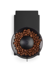FELLOW | Opus Conical Burr Grinder, Matte Black, top-down view of bean hopper with central grind-setting knob and spout, showcasing versatility for various coffee brewing styles.