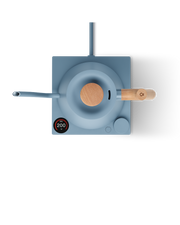 FELLOW | Stagg EKG Pro Electric Kettle, Hazy Blue w/ Maple sits on an induction cooktop, displaying 200°F on its control panel, showcasing precision brewing.