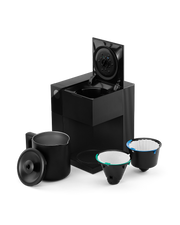 FELLOW | Aiden Precision Coffee Maker, Matte Black with a lifted lid, black carafe, and two reusable filter baskets for effortless, pour-over-style brewing.