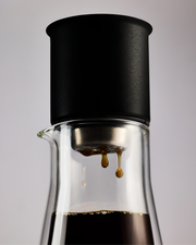 FELLOW | Stagg [XF] Set pour-over system with black dripper atop a clear carafe, showcasing precision brewing with even extraction and consistent heat retention.