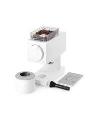 FELLOW | Ode Brew Grinder Gen 2, Matte White with coffee beans in hopper, dosing cup, cleaning brush, and grind guide for precise brewing in kitchen settings.