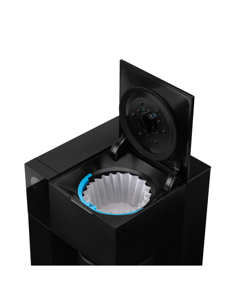 FELLOW | Aiden Precision Coffee Maker with open brew-basket, showing a paper filter inside, exemplifies pour-over precision for effortless, consistent coffee brewing.