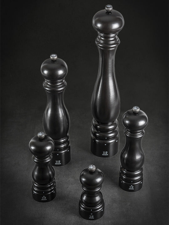 Peugeot | Paris u'Select Wooden Pepper Mill, Satin Black, features a sleek design with a high-precision grind adjustment, standing elegantly among other mills.