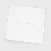 Joanna Buchanan Party Set includes cocktail picks and wine charms, presented in a stylish white box with silver text.