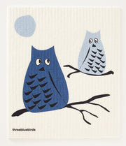 Three Bluebirds Swedish Dishcloths | Swedish Dishcloths - Blue Whoo? featuring an owl illustration on a blue background, highlighting its eco-friendly, super absorbent, and biodegradable qualities.