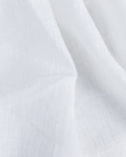 Elegant forest green linen tablecloth from MagicLinen, 59 x 98 inches, featuring a simple seam finish, perfect for various dining settings and occasions.