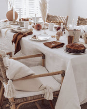MagicLinen forest green linen tablecloth, 59 x 98 inches, with simple seam finish, ideal for versatile dining setups at Athens Cooks.