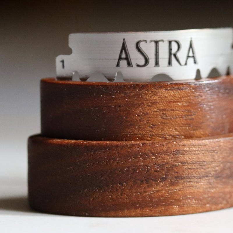 Wire Monkey | Arc Lame displayed with a double-edged Astra razor blade in an American Black Walnut stand, highlighting its elegant design for precise dough slashes.