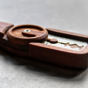 Wire Monkey | Goose Lame: Handcrafted wooden handle with pivoting cover, clamping a double-edge razor blade, ideal for precise dough slashing, featuring stainless steel hardware.