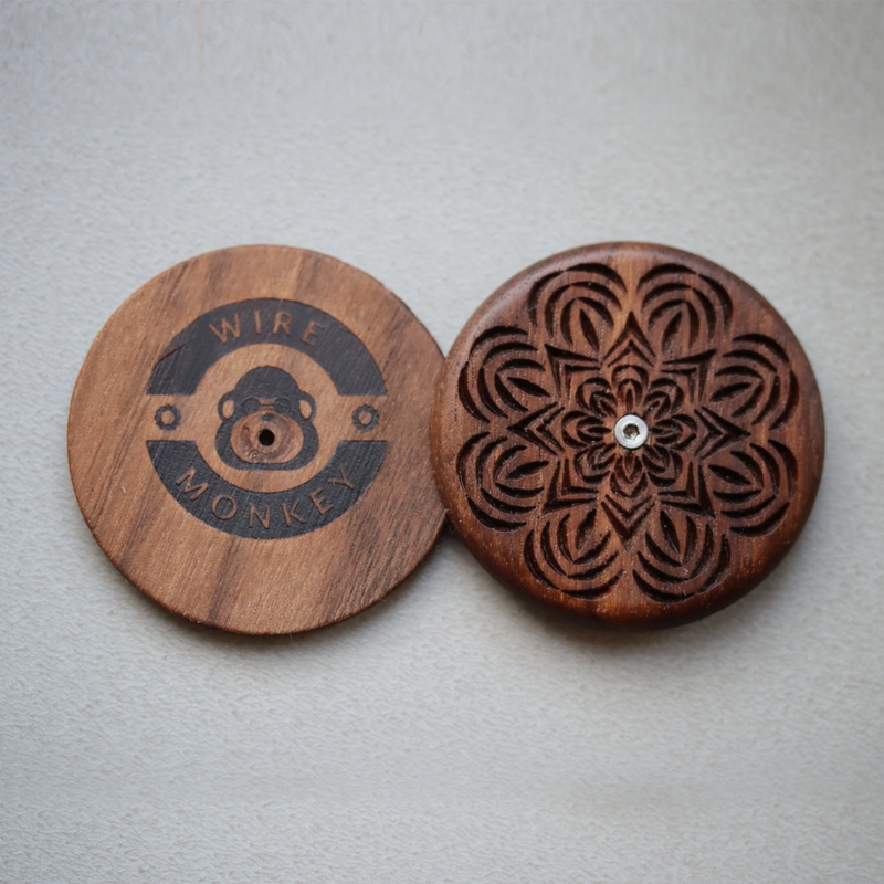 Wire Monkey UFO Bread Journey Lame halves, featuring a laser-etched logo and mandala carving, crafted from American black walnut for intricate bread scoring.