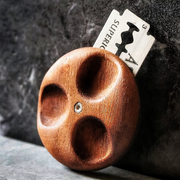 Wire Monkey | UFO NUX Lame, a palm-sized wooden hand-scraper with deep finger grooves, featuring a slotted razor blade for easy scraping tasks on hard surfaces.