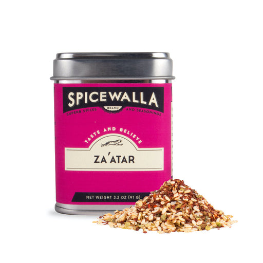 Spicewalla | Za'atar spice tin with a small pile of the aromatic, Middle Eastern seasoning blend, featuring sumac, sesame, cumin, and herbs.
