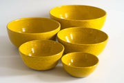 RachaelPots | Set of Five Nesting Bowls - Yellow, hand-thrown in Brooklyn, features varied sizes with hand-trimmed foot, ideal for versatile food prep and serving.