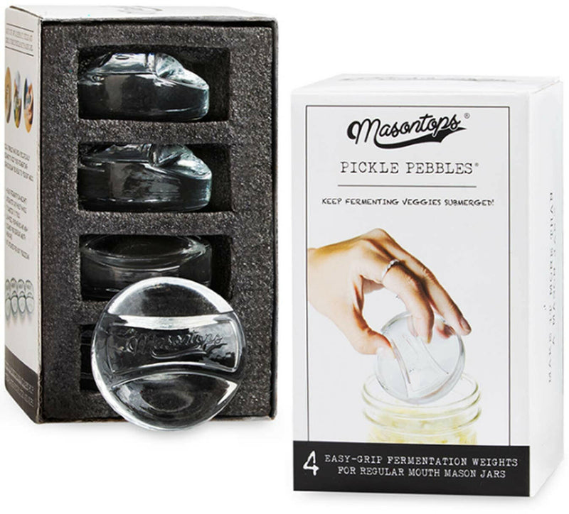 Masontops | Glass Fermentation Weights - Wide Mouth shown in use, a hand holds a glass weight, ideal for submerging foods in Mason jars during fermentation.