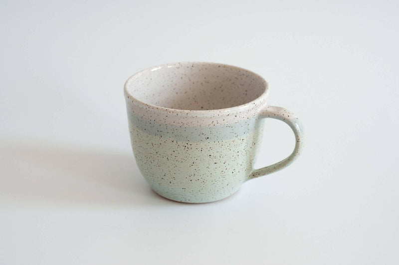 RachaelPots | Jumbo Mug - Nude-Light Blue, a hand-thrown 18 oz mug with thumb rest, ideal for coffee or soup, showcasing unique craftsmanship.