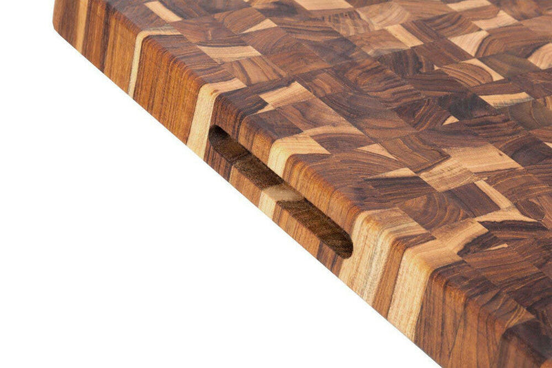 Teakhaus | Butcher Block Rectangle Cutting Board, 20 x 15, showcasing its hardwood grain and end-grain pattern, crafted from FSC-certified sustainable teakwood.