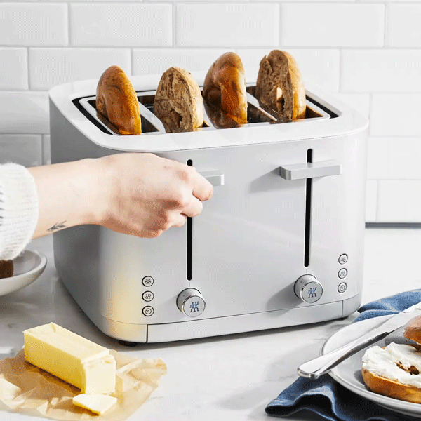 ZWILLING Enfinigy 4-Slot Toaster showcasing four slots, soft-lift feature, and a removable crumb tray, ideal for even toasting and safe toast retrieval.