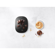 Zwilling Digital Kitchen Scale - Silver with seamless glass surface, large weighing area, hidden display, and rechargeable battery, ideal for precise measurements in cooking and baking.