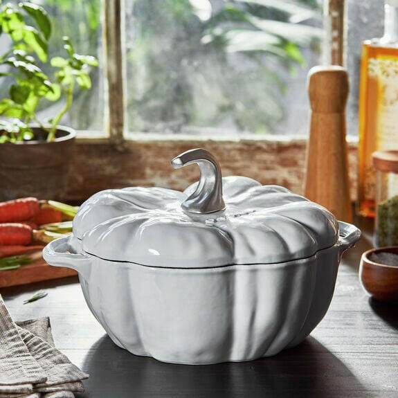 Staub Pumpkin Cocotte in Burnt Orange, a cast iron pot shaped like a pumpkin, ideal for slow-cooking and enhancing your kitchen's charm from Athens Cooks.
