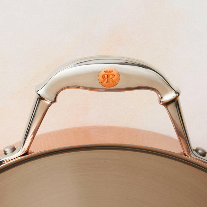 Ruffoni | Symphonia Cupra | Braisers - 7QT with stainless steel handles featuring inlaid copper coin, ideal for stovetop-to-oven cooking and family-style meals.