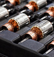 Set of electric-motor armatures in tray, showcasing Ankarsrum | Stand Mixers' powerful 1500 W motor at Athens Cooks, ideal for versatile kitchen tasks.