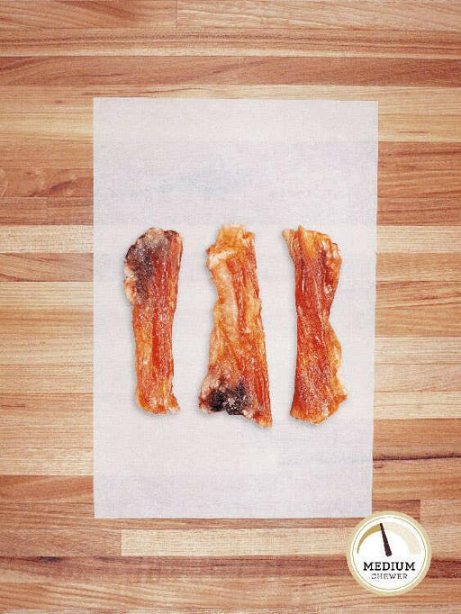 Farm Hounds | Beef Hock Tendon Chews - Large, close-up of dehydrated chews ideal for small to medium dogs, showcasing their textured surface and enticing tallow coating.