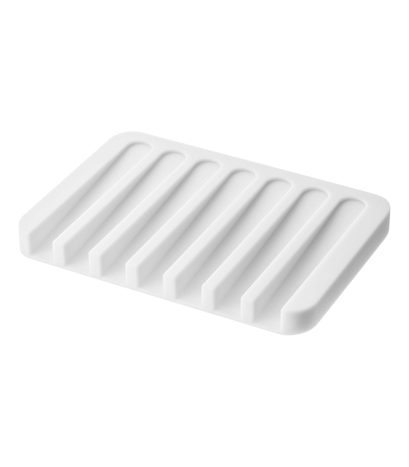 Yamazaki Home | Flow Self-Draining Soap Tray | Silicone - White: Rectangular tray with ridges, designed to keep soap dry by draining water back into the sink.