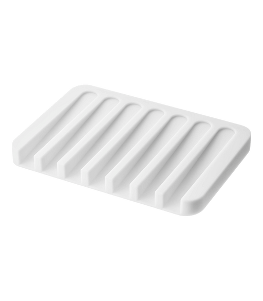 Yamazaki Home | Flow Self-Draining Soap Tray | Silicone - White: Rectangular tray with ridges, designed to keep soap dry by draining water back into the sink.