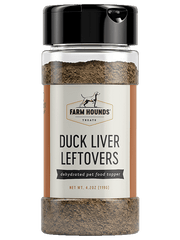 Close-up of Farm Hounds | Food Toppers - Duck Liver, highlighting the container and black device, representing sustainable, nutrient-rich sprinkles for enhancing meals.