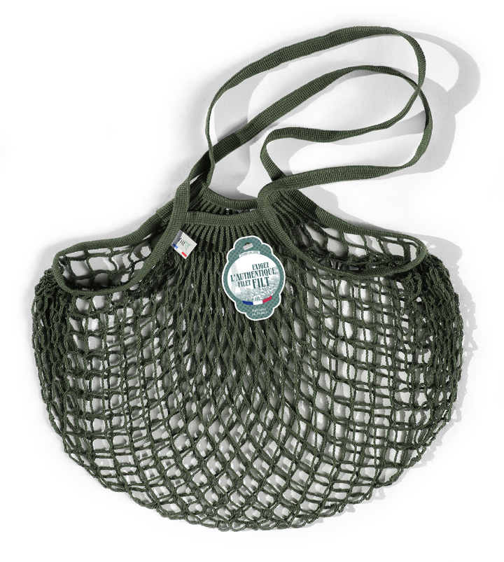 Filt | French Market Bags - Gold: Green net bag with label, ideal for carrying groceries like wine and produce, blending style with eco-friendly utility.