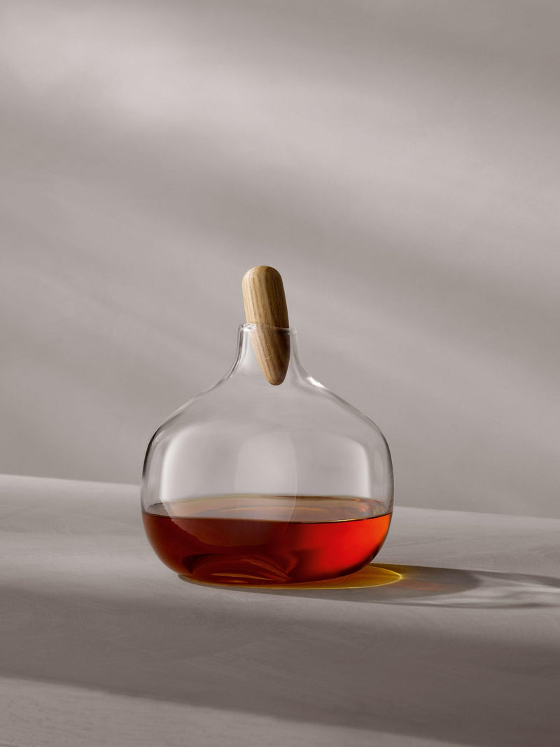 LSA International Float Decanters with walnut stoppers, showcasing an elegant design with mouth-blown glass, perfect for enhancing any home bar.