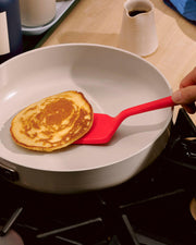 GIR | 5-Piece Ultimate Tool Set - Sprinkles: A pancake on a red spatula, showcasing premium kitchen utensils for versatile cooking in any kitchen environment.