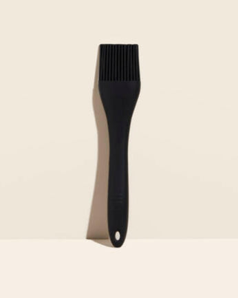 GIR | Basting Brush - Black, featuring dual silicone bristles for efficient liquid application, shown on a white surface. Ideal for durable, controlled kitchen use.