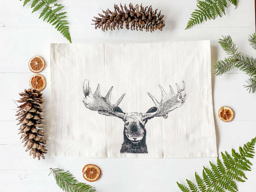 Your Green Kitchen | Holiday Tea Towels feature pinecone and moose embroidery, crafted from organic cotton, perfect for stylish and functional kitchen use.