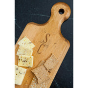 J.K. Adams Maple Artisan Plank Serving Board, featuring an engraved, vintage finish, ideal for serving bread and cheeses with rustic charm and durability.