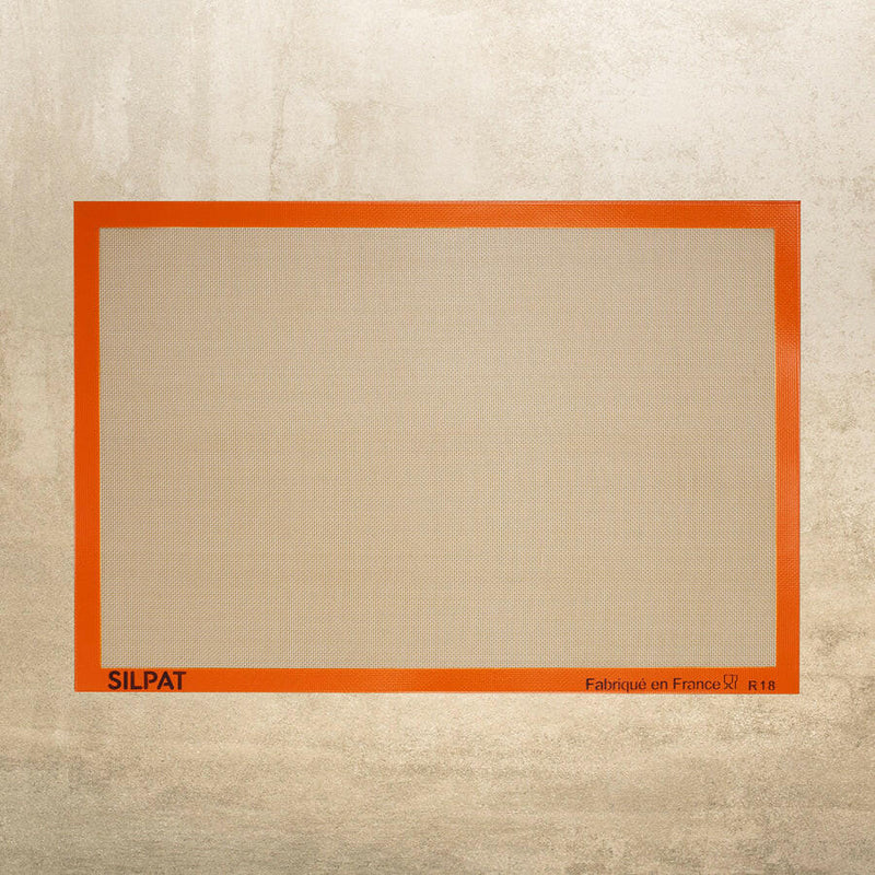 Silpat Nonstick Baking Mats with Sil-Band, featuring reinforced fiberglass mesh for effortless baking. Available in various sizes to suit different baking needs.