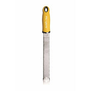 Microplane Premium Classic Zester Grater with a yellow handle, ideal for zesting citrus or grating cheese, featuring sharp stainless steel blades for precise results.