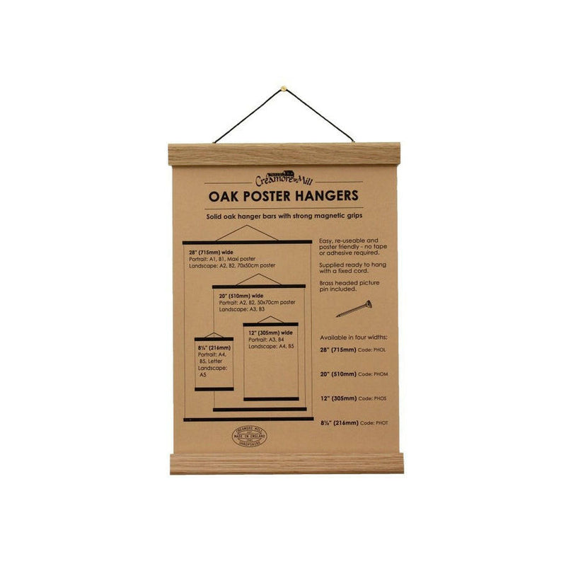 Earth & Nest | Oak Poster Hanger - Medium, featuring strong magnetic grips and a fixed cord, perfect for elegantly displaying posters or fabrics without adhesive.