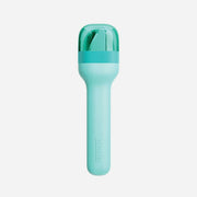 Zoku | Pocket Utensil Sets - Charcoal, featuring a compact blue cylinder case with a green handle, containing a fork, spoon, and knife. Perfect for on-the-go dining.