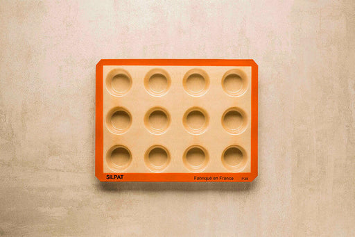 Silpat Reusable Silicone Baking Molds - Tartelette Mold, featuring 12 easy-release, non-stick cavities for perfectly shaped pastries and quiches, ideal for home bakers.
