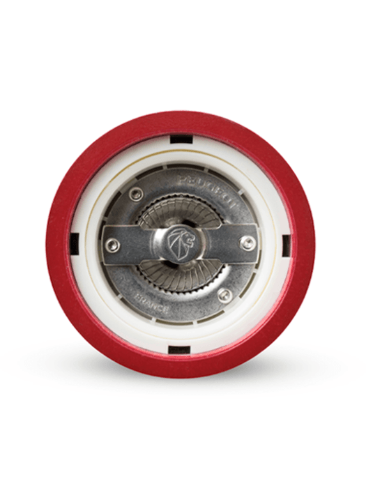Peugeot | Paris Chef u'Select Passion Red Pepper Mill underside showing grinding mechanism with red housing, white spacer, and serrated metal burr stamped Peugeot France.